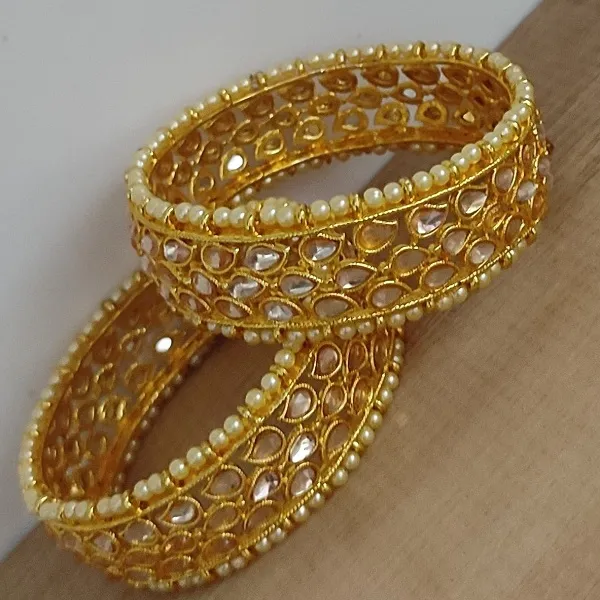 https://d1311wbk6unapo.cloudfront.net/NushopCatalogue/tr:f-webp,w-600,fo-auto/BANGLES 140-KUNDAN_1674124664293_3m83sj17v5dnnv7.jpg__Padmawati Bangles   Private Limited